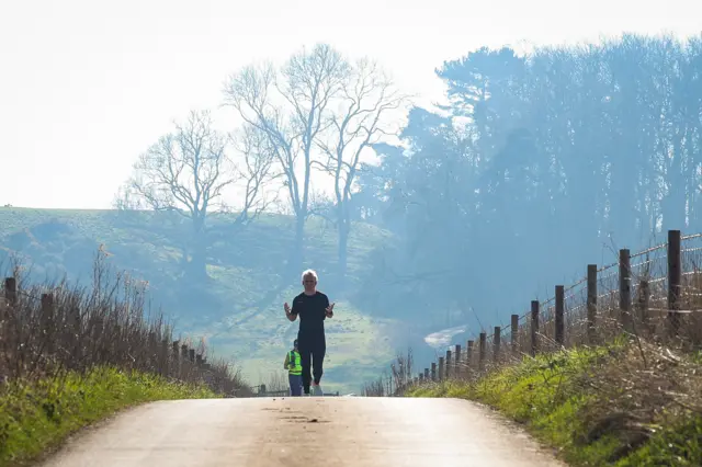 Jamie Laing reaches the top of a hill on Day 3 of his ultra marathon challenge for Comic Relief