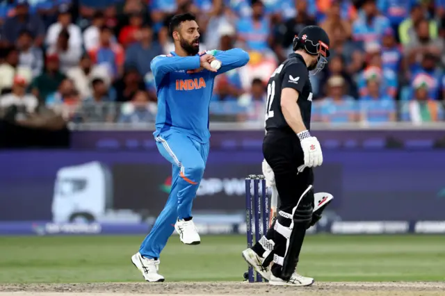 Varun Chakravarthy of India bowls