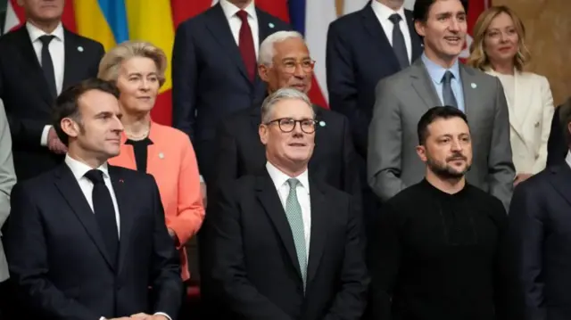 The leaders pose in rows for a group photo