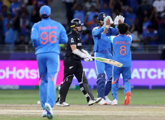 Ravindra Jadeja celebrates the wicket of Tom Latham
