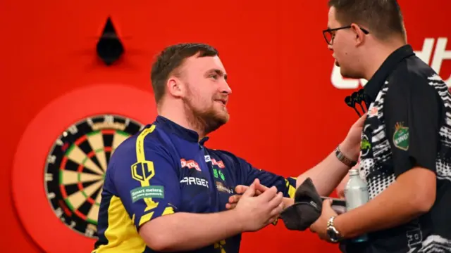 Luke Littler embraces Gian van Veen after beating him in the UK Open quarter-final