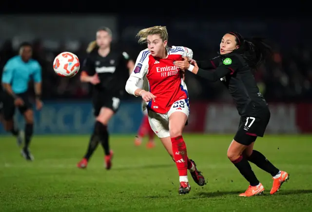 Arsenal's Alessia Russo (left) and West Ham United's Camila Saez battle for the ball