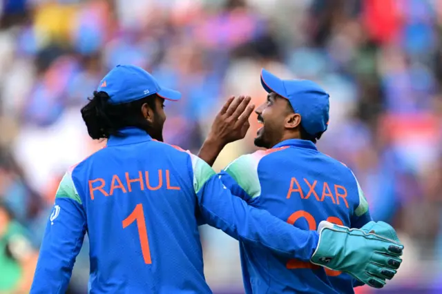 Axar Patel celebrates the wicket of Rachin Ravindra