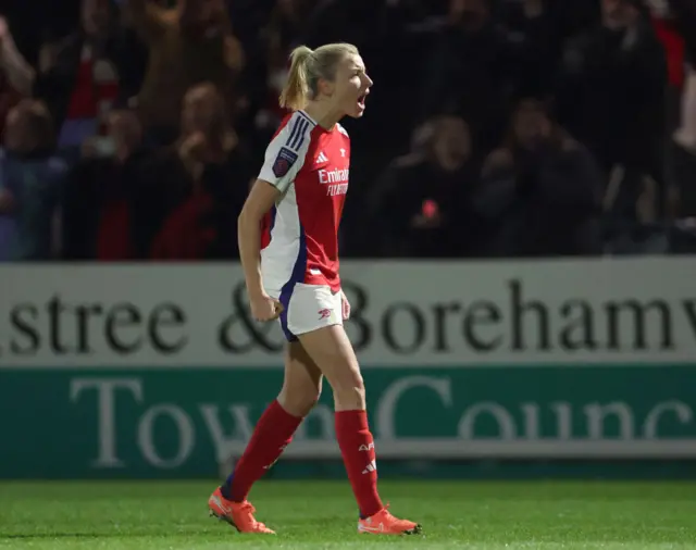 Williamson shouts to the crowd as she celebrates her goal