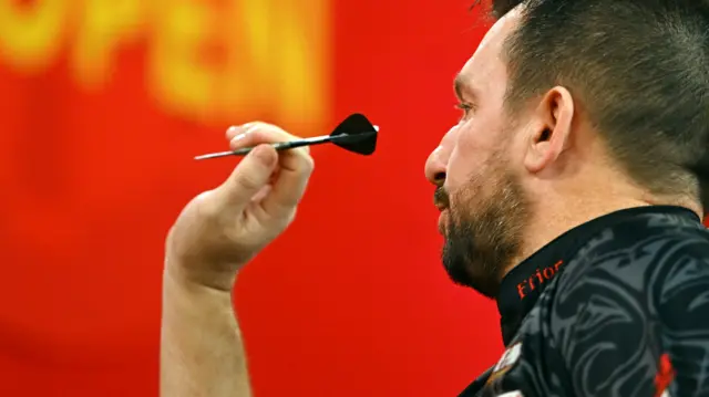 Jonny Clayton throws a dart