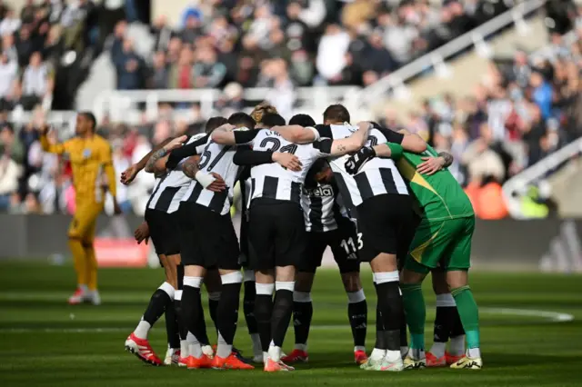 Newcastle United's players gather prior