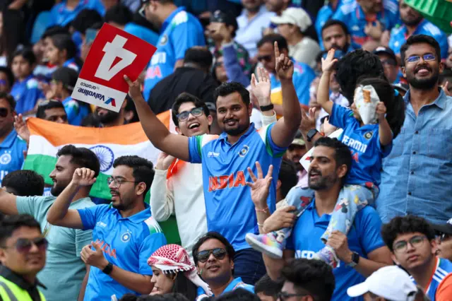 India fans celebrate a boundary