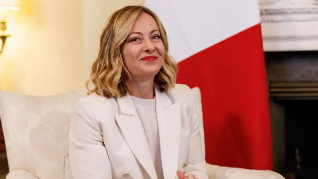 Italy Prime Minister Giorgia Meloni smiles at the camera