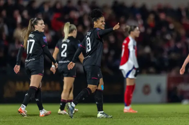 Martinez celebrates her goal v Arsenal with a thumbs up to the bench