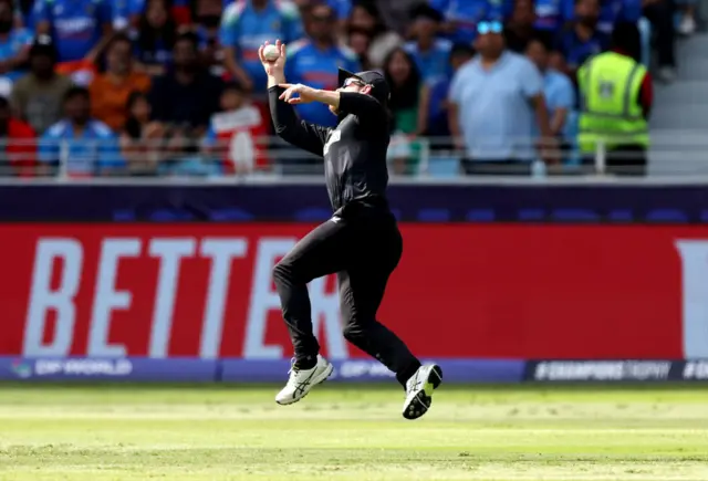 Kane Williamson takes a catch to dismiss Axar Patel