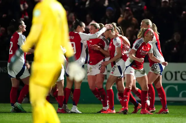 Arsenal players celebrate one of their goals v West Ham