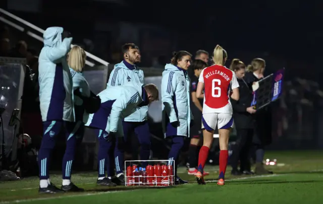 Slegers issues instructions to Williamson near the dugout