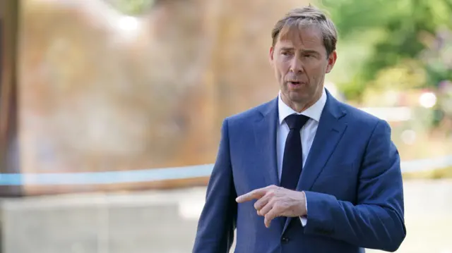 Tobias Ellwood speaking to the media on College Green outside the Houses of Parliament