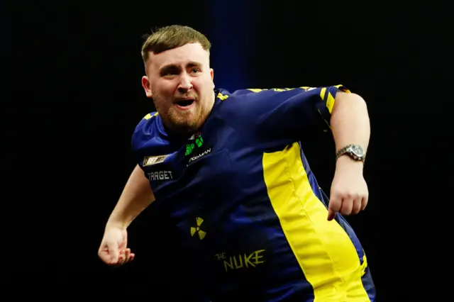 Luke Littler celebrates a nine-darter