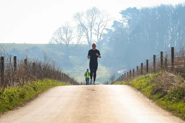 Jamie Laing runs up a road