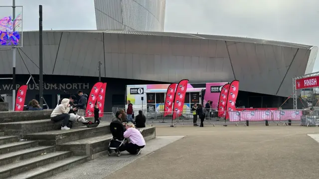People gathering outside a building