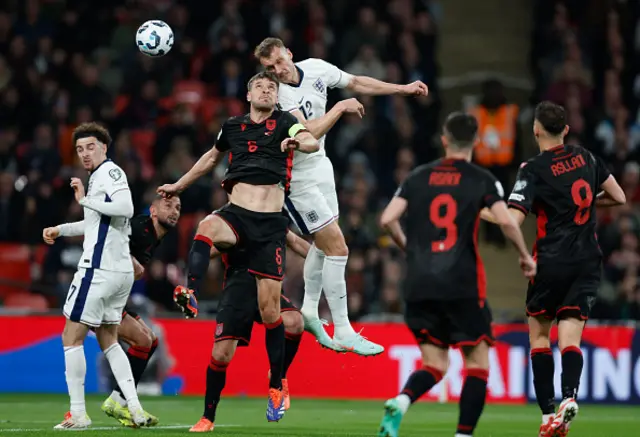 Dan Burn of England heads the ball