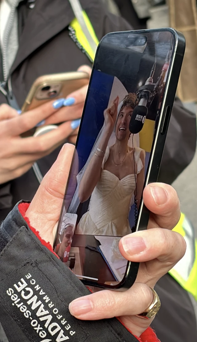 Jamie seeing Greg in a wedding dress on his phone