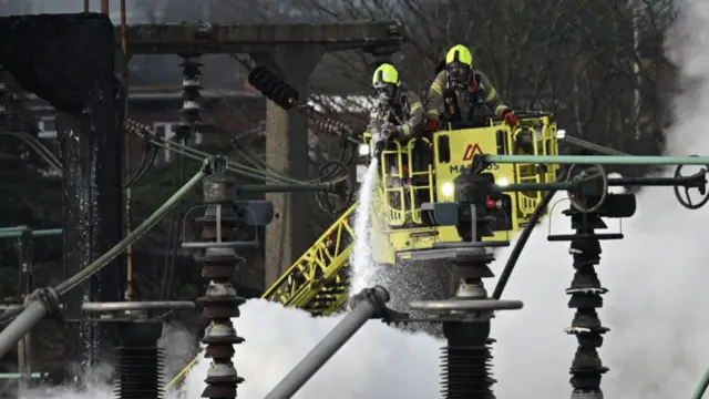 Members of the Fire Brigade attend the scene following a major fire at an electrical substation at Heathrow on March 21, 2025 in London, England.