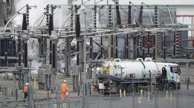 Electricity workers at the North Hyde electrical substation which caught fire