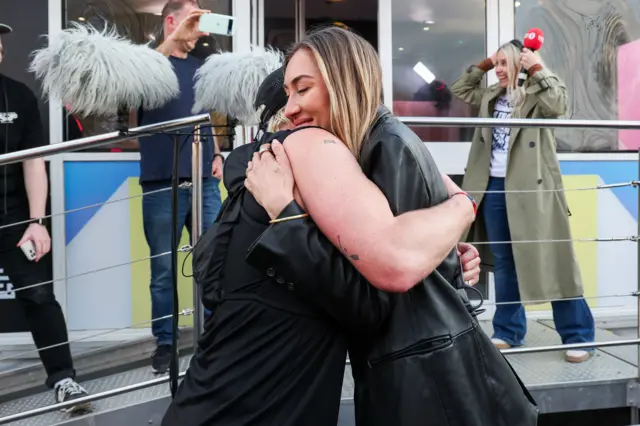 Jamie hugging his wife Sophie