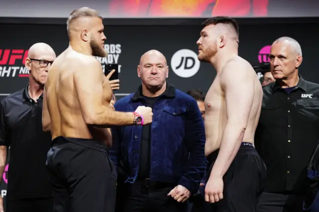 Marcin Tybura faces off Mick Parkin at a weigh-in