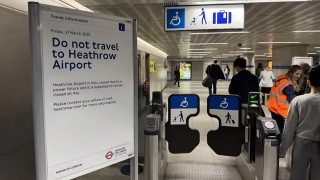 Image shows sign at King's Cross tube station, warning commuters to avoid travelling to Heathrow Airport as it is fully closed