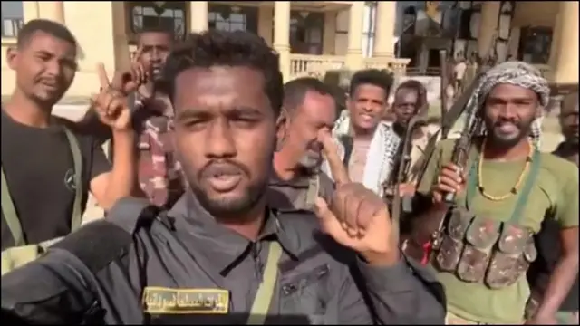 Sudanese army stand outside the republican palace