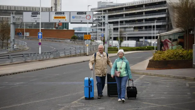 Two passengers head to Heathrow airport