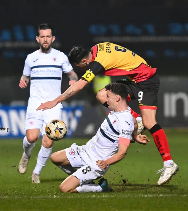 GLASGOW, SCOTLAND - MARCH 22: Partick's Brian Graham (R) and Raith;s Ross Matthews in action during a William Hill Championship match between Partick Thistle and Raith Rovers at the Wyre Stadium at Firhill, on March 22, 2025, in Glasgow, Scotland. (Photo by Paul Byars / SNS Group)