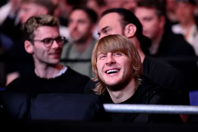 Paddy Pimblett smiles in attendance at a fight