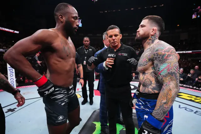 Leon Edwards and Sean Brady getting instructions from the referee