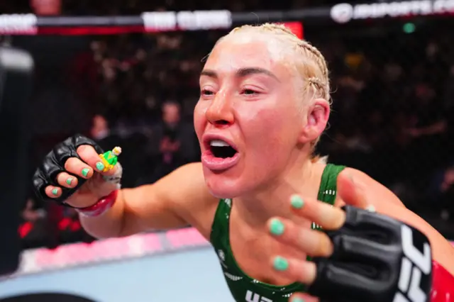 Shauna Bannon celebrates with a little green lego man