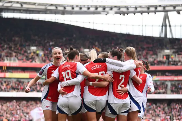 Arsenal players celebrate a goal v Tottenham at the Emirates earlier this season