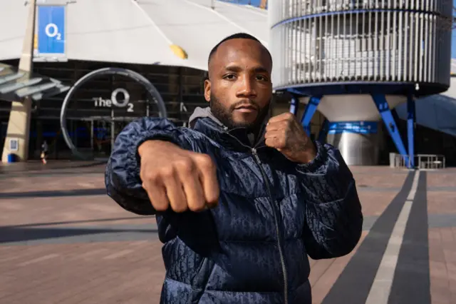 Leon Edwards holds out his fist as he stands outside the O2 Arena in London