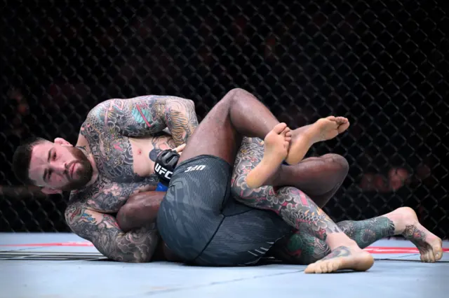 Sean Brady grappling with Leon Edwards