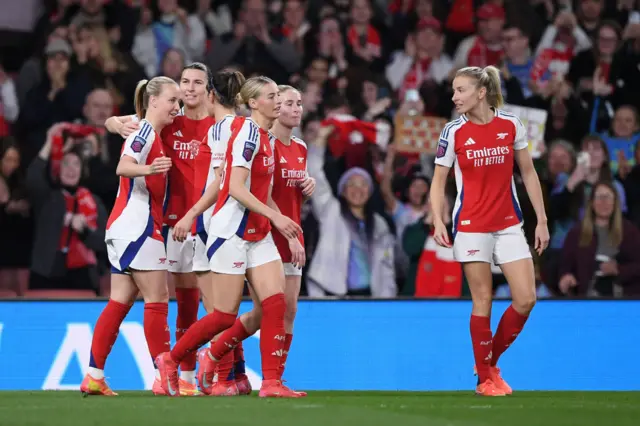 Arsenal players celebrate a goal v Liverpool