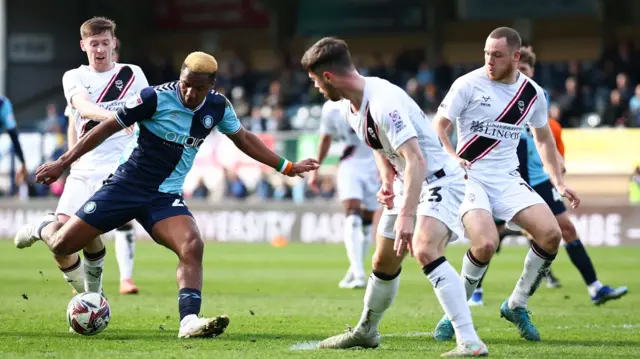 Richard Kone of Wycombe Wanderers with a shot on goal