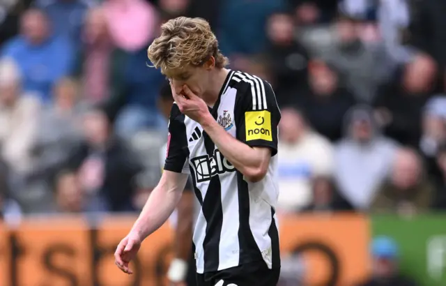 Anthony Gordon looks down after being sent off