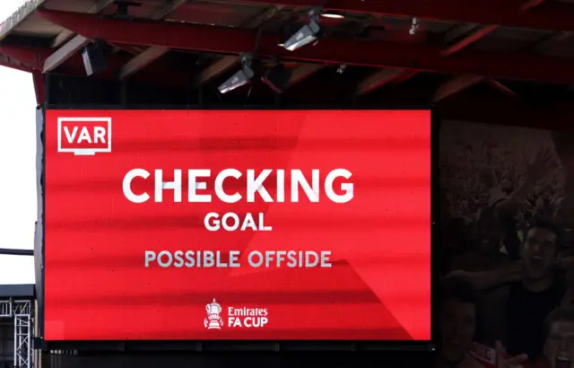 The big screen at the Vitality Stadium showing a VAR check