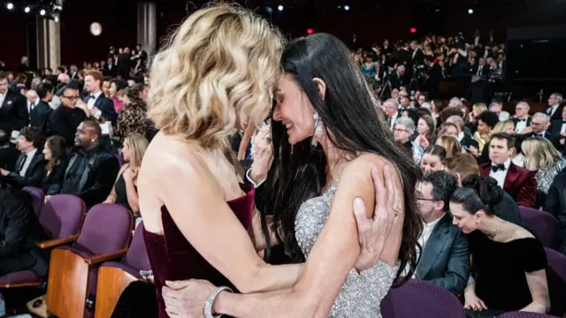 Meg Ryan and Demi Moore put their heads together