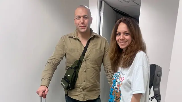 Hossein Molayemi and Shirin Sohani with their suitcases