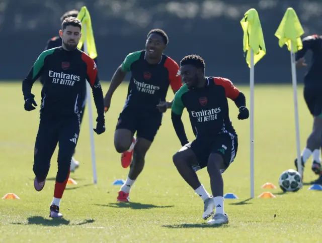 Arsenal's Jorginho, Myles Lewis-Skelly and Nathan Butler-Oyedeji during training