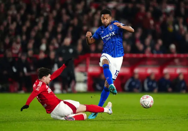 Nottingham Forest's Neco Williams tackles Ipswich Town's Jens Cajuste.
