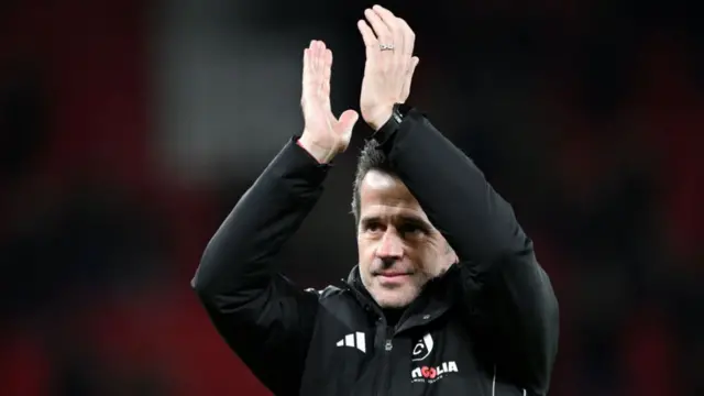 Marco Silva, Manager of Fulham, applauds the fans.