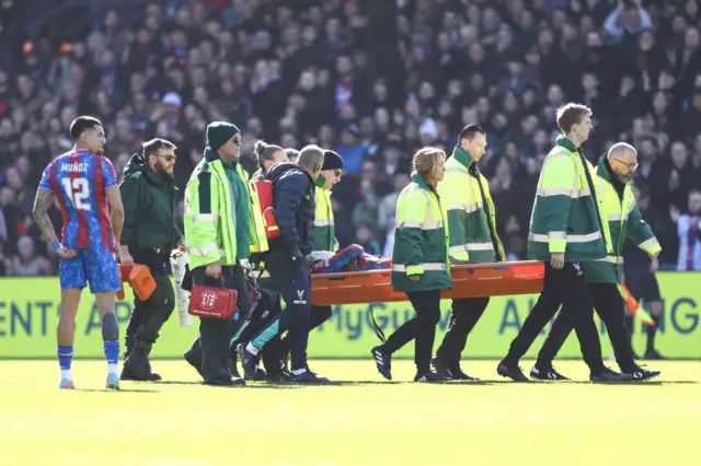 Jean-Philippe Mateta being stretchered off against Millwall