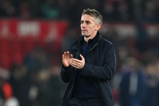 Kieran McKenna, Manager of Ipswich Town, applauds the fans.