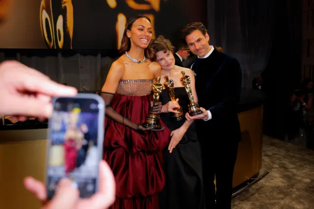 Zoe Saldana poses with Clement Ducol and Camille