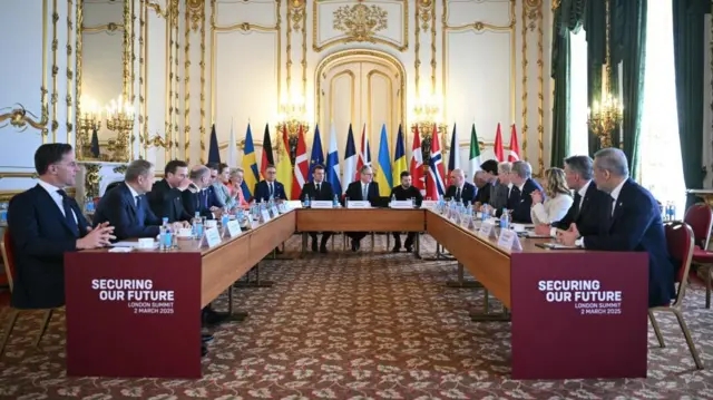 Leaders sit around a table during yesterday's summit