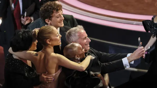 Ariana Grande, boyfriend Ethan Slater and Cynthia Erivo are among the Wicked cast members caught taking a selfie